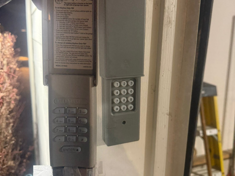 A bench vise mounted on a wooden workbench in a garage workshop, the kind of hands-on setting opener diagnostics happen in